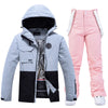 Damen-Skijacke und -hose in Colorblock-Optik für jedes Wetter, geeignet für Outdoor-Aktivitäten.
