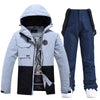 Damen-Skijacke und -hose in Colorblock-Optik für jedes Wetter, geeignet für Outdoor-Aktivitäten.